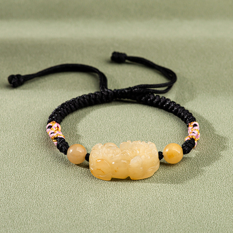 Natural Golden Silk Jade Pi Xiu Bracelet โ Handwoven Peach Blossom Knot, Unisex Feng Shui Jewelry