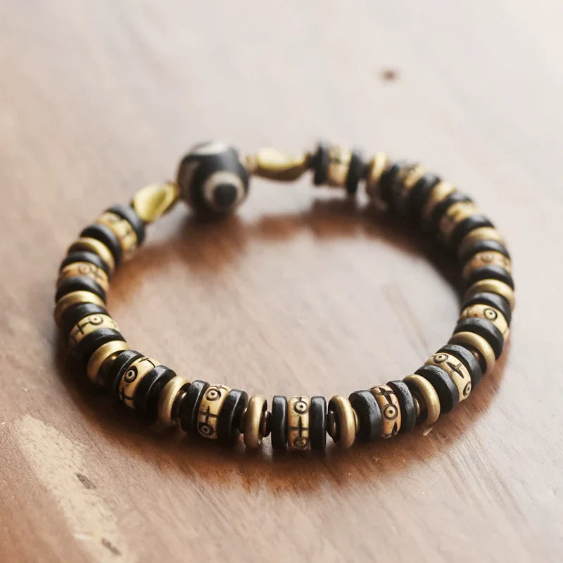 Tibetan-Style Hand-Carved Bone Bead Bracelet with Ebony and Brass Spacers, and Agate Dzi
